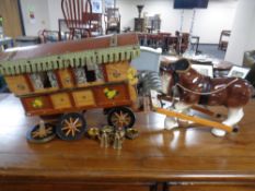 A wooden Romany caravan together with a china shire horse