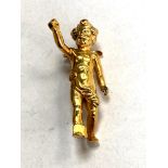 An antique yellow metal Cupid brooch