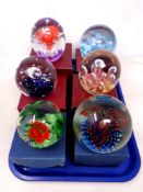 A tray containing six large glass paperweights (boxed)