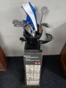 A golf bag containing a set of Regency golf clubs together with a boxed fitness kit.
