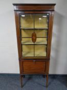 An Edwardian inlaid mahogany display cabinet fitted music cupboard below on raised legs (a/f)
