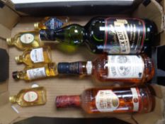 A box of alcohols and miniatures including Southern Comfort, Black Bottle Scotch whisky,