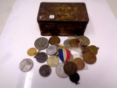 A vintage tin containing coronation medals (22 in total)