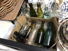 A box containing a quantity of antique and later glass bottles