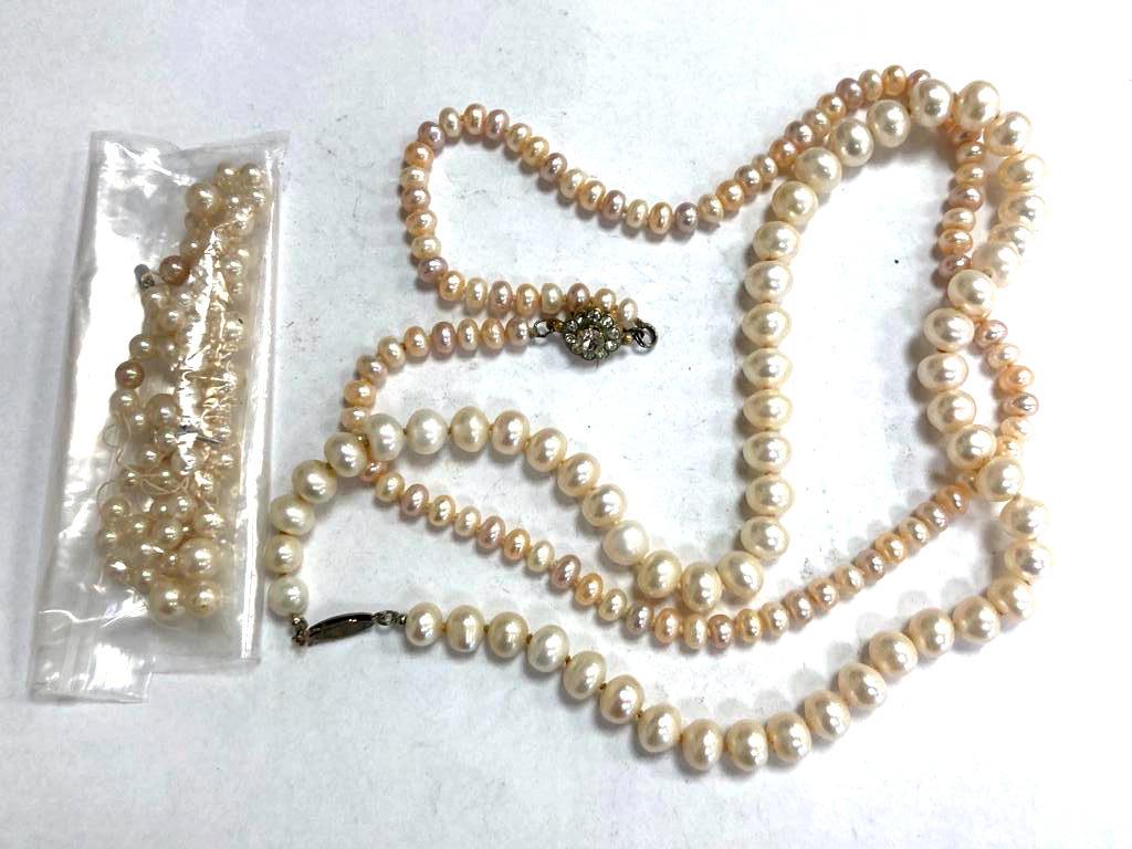 Three straps of pearls including one with 9ct gold clasp (requires re-stringing)