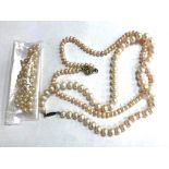 Three straps of pearls including one with 9ct gold clasp (requires re-stringing)