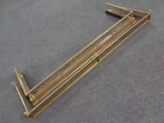 A 19th century brass fret work fire curb and a further fire curb