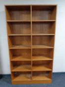 A set of 20th century teak effect open bookshelves