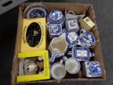 A box containing boxed and unboxed Ringtons ceramics to include money boxes,