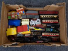 A box containing a quantity of Triang 00 scale rolling stock to include engines, tenders, coaches,