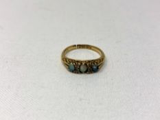 An 18ct gold opal and diamond ring (shank split) CONDITION REPORT: 3.