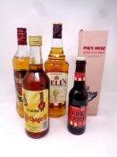 A crate of alcohol to include Bells Scotch whisky, Grants whisky,