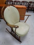 An Ercol elm and beech rocking chair in an antique finish