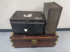 Two antique tin deed boxes together with a further antique wooden bound shipping trunk