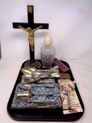 A tray containing magnifying glass, pens, antique crucifix on stand,