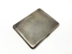 A silver cigarette case with engine turned decoration CONDITION REPORT: 154g