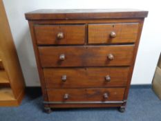 A 19th century stained pine five drawer chest