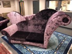 An oversized chaise longue upholstered in purple crushed velvet.