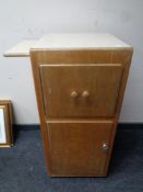 A 20th century wood and melamine hospital bedside cabinet