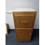 A 20th century wood and melamine hospital bedside cabinet