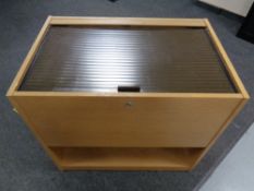 An office mobile filing chest in an oak finish