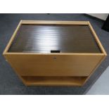 An office mobile filing chest in an oak finish