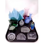 A tray of contemporary clear and coloured glass paperweights, Caithness vases,