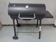 A drum barbecue on stand