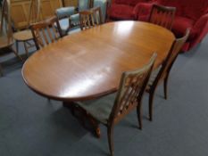 A 20th century oval teak G-Plan dining table together with a set of five rail back chairs