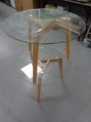 A pair of contemporary glass topped lamp tables