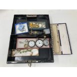 A vintage cash tin containing 9ct gold cased lady's vintage watch face, two silver pocket watch,