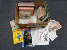 A box containing 20th century books and magazines relating to magic,