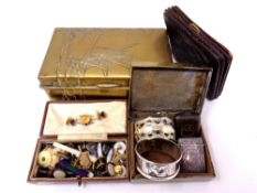 Two brass cigarette boxes containing silver Vesta case, silver and plated napkin rings, dress studs,
