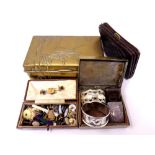 Two brass cigarette boxes containing silver Vesta case, silver and plated napkin rings, dress studs,