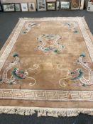 A Chinese carpet, 380 cm x 278 cm. CONDITION REPORT: Stained.