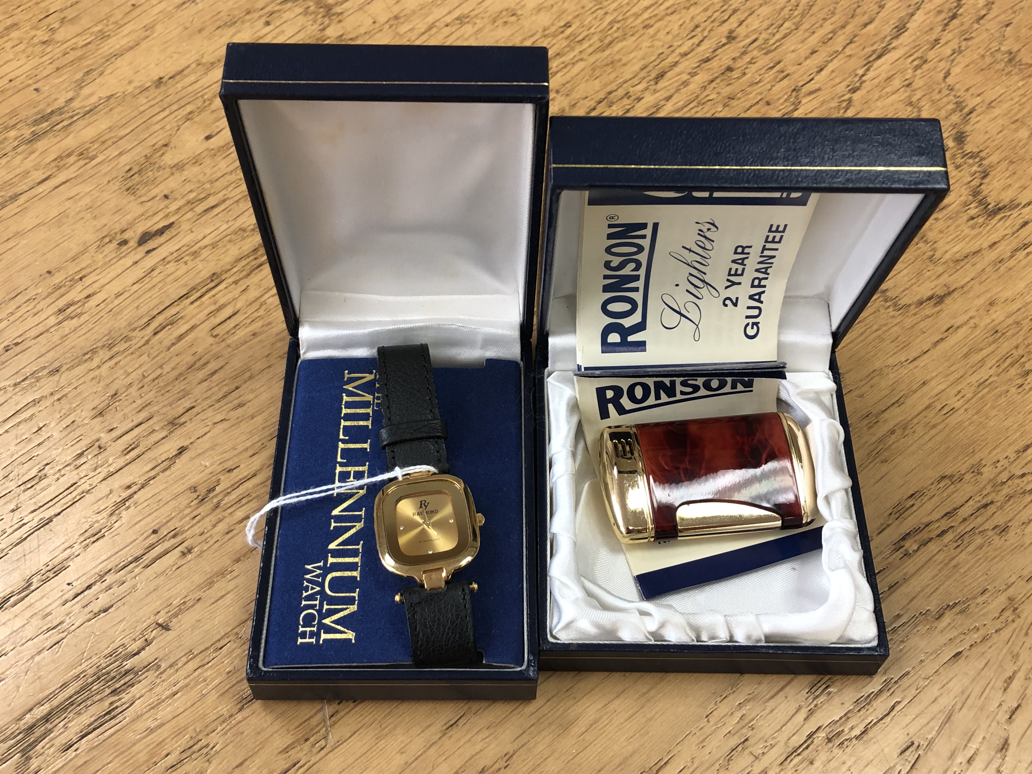 A Ronson gilt and tortoiseshell-effect cigarette lighter (boxed),
