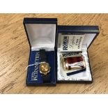 A Ronson gilt and tortoiseshell-effect cigarette lighter (boxed),