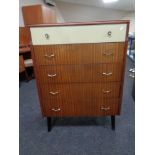 A mid 20th century teak two tone five drawer chest