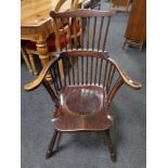 A 19th century stick back commode armchair