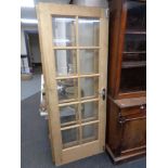 A pair of pine interior doors with glass inset panels, height 198 cm.