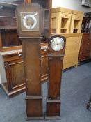 An oak cased Art Deco granddaughter clock together with a further granddaughter clock