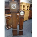 An oak cased Art Deco granddaughter clock together with a further granddaughter clock