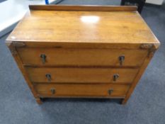 An Edwardian oak chest of three drawers. Width 89 cm x depth 45 cm x height 81 cm.