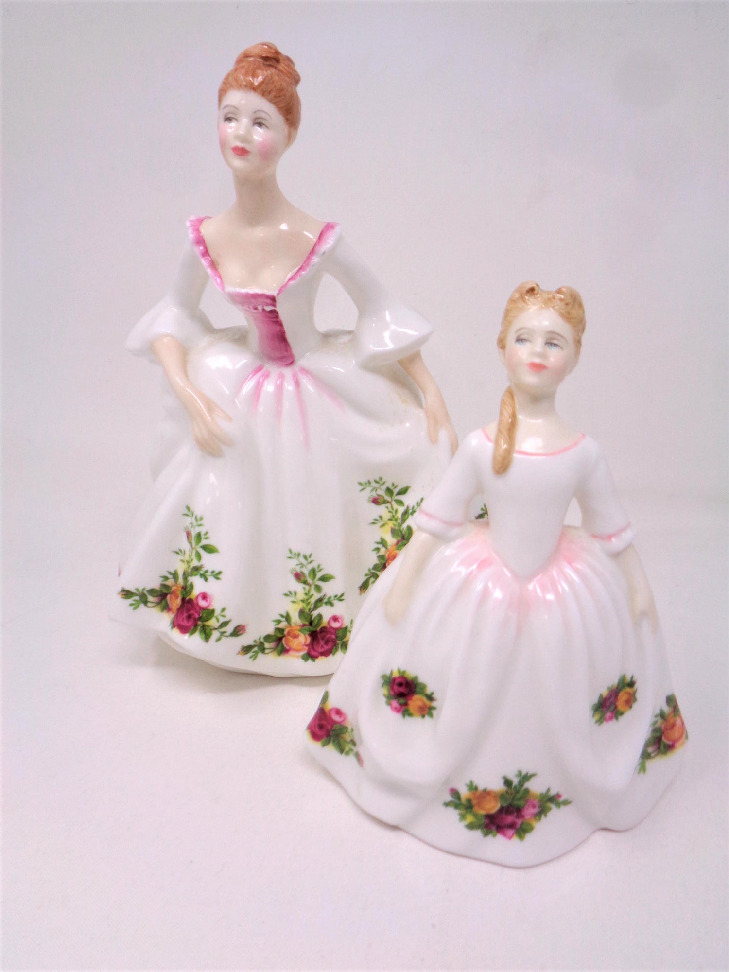 Two Royal Doulton Country Rose figures,