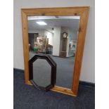 A pine framed mirror together with a further Edwardian octagonal framed mirror