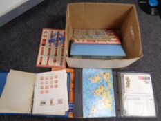 A box containing stamp albums containing 20th century world stamps and stamp collecting books