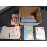 A box containing stamp albums containing 20th century world stamps and stamp collecting books
