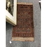 An Afghan rug 55 cm x 107 cm