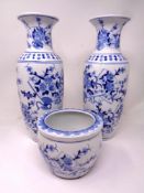 A pair of contemporary Chinese blue white baluster vases together with a small plant pot,