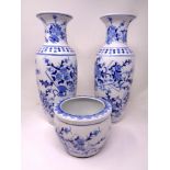 A pair of contemporary Chinese blue white baluster vases together with a small plant pot,